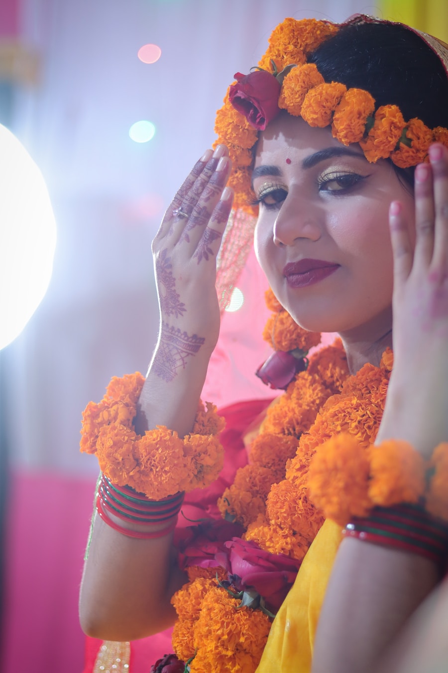 Bride with marigold floral jewelry at Haldi ceremony